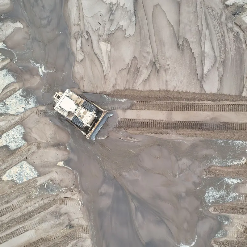 Drone shot of a bulldozer moving sand in Trevino, Wisconsin. Aerial view.